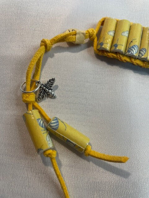 Bee Harmony: Handmade Paper Bead Bracelet with Yellow Suede Cord and Charming Bee Accents