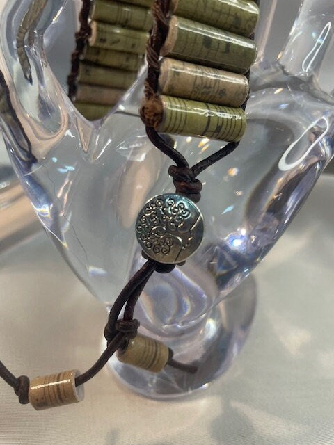 Melody of Nature: Handcrafted Paper Bead Bracelet with Music Note Paper, Brown Leather Cord, and Tree of Life Button